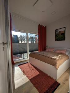 Postel nebo postele na pokoji v ubytování Tinyhouse Daniel