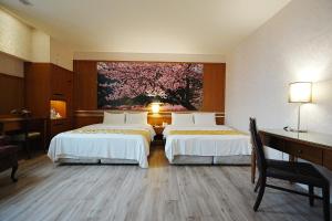 Postel nebo postele na pokoji v ubytování York Hotel