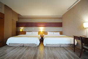 Postel nebo postele na pokoji v ubytování York Hotel
