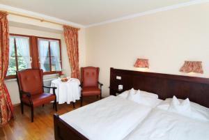 Postel nebo postele na pokoji v ubytování Hotel Leicht