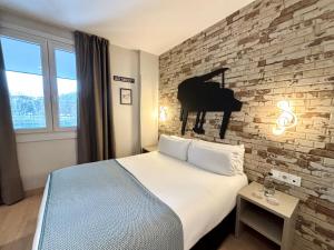 Postel nebo postele na pokoji v ubytování Colectia Hotel Urumea