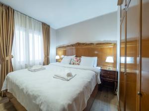 Postel nebo postele na pokoji v ubytování Hotel Perun