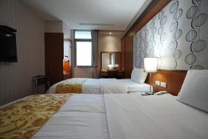 Postel nebo postele na pokoji v ubytování York Hotel