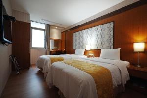 Postel nebo postele na pokoji v ubytování York Hotel