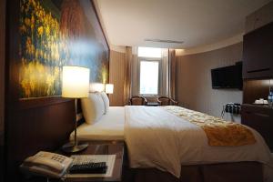 Postel nebo postele na pokoji v ubytování York Hotel