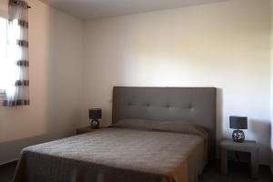 En eller flere senge i et værelse på Les Lauriers Roses