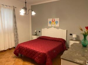 Postel nebo postele na pokoji v ubytování Villa Piruzzu CV Torre Mulinazzo app P