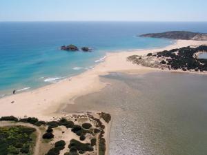 an aerial view of a beach and the ocean at Hotel Spartivento in Chia