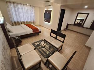 Krevet ili kreveti u jedinici u objektu Hotel Vijay Sagar Dombivali