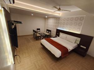 Krevet ili kreveti u jedinici u objektu Hotel Vijay Sagar Dombivali