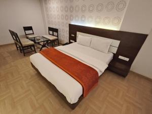 Krevet ili kreveti u jedinici u objektu Hotel Vijay Sagar Dombivali