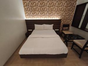 Krevet ili kreveti u jedinici u objektu Hotel Vijay Sagar Dombivali
