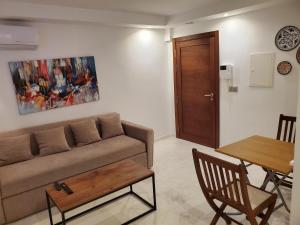 a living room with a couch and a table at luxury marsa beach 2 in La Marsa +19 photos