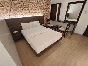 Krevet ili kreveti u jedinici u objektu Hotel Vijay Sagar Dombivali