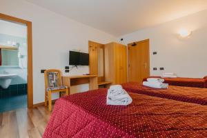 Postel nebo postele na pokoji v ubytování Hotel Spera