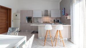 Η κουζίνα ή μικρή κουζίνα στο Mameli Apartment