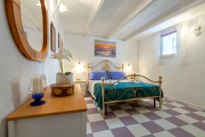 En eller flere senge i et værelse på Le Antiche Conce 2