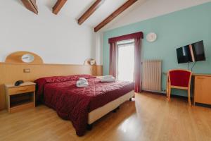 Postel nebo postele na pokoji v ubytování Hotel Spera