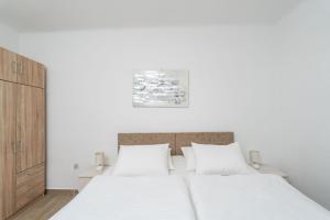 Postel nebo postele na pokoji v ubytování Apartment Family Tokic