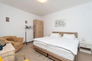 Postel nebo postele na pokoji v ubytování Apartment Family Tokic