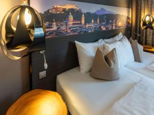 Posteľ alebo postele v izbe v ubytovaní Mercure Salzburg City