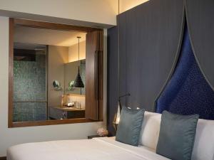 Avista Hideaway Phuket Patong - MGallery客房内的一张或多张床位
