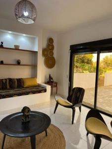 Ecolodge La Grande Tortue - Maison d'hôtes的休息区