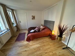 a bedroom with a bed with a laptop on it at Kattesundet Apartments Best Location in Copenhagen in Copenhagen
