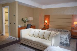 Postel nebo postele na pokoji v ubytování Hotel Perusia