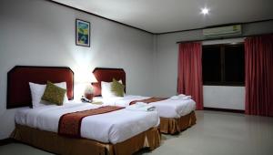 Tempat tidur dalam kamar di Pro Andaman Place
