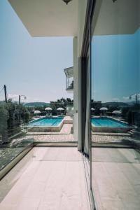a view of a swimming pool from a house at White House Apartment in Kalami