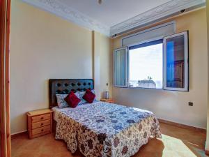 Ένα ή περισσότερα κρεβάτια σε δωμάτιο στο Appartement centre de Taghazout - WiFi 200Mbps