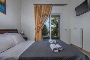Ένα ή περισσότερα κρεβάτια σε δωμάτιο στο Villa Natura