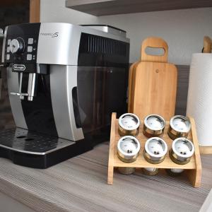 a microwave and some cupcakes in front of a coffee maker at Landhof Nebel in Sankt Andrä-Höch +27 photos