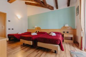 Postel nebo postele na pokoji v ubytování Hotel Spera