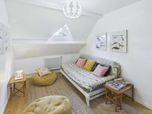 a living room with a couch and a table at Maison pour 8 - Piscine chauffée - 800m de la plage in Penmarcʼh +21 photos