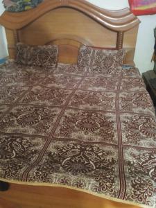 Postel nebo postele na pokoji v ubytování Santosh Homestay