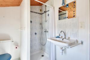 a bathroom with a sink and a shower at Maison pour 7 à 900m de la plage avec jardin in Barbâtre +7 photos