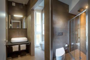 a bathroom with a sink and a toilet and a shower at Soggiorno Campos in Florence