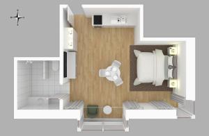 a floor plan of a room with a bathroom at Moderne neue Apartments zum Wohlfühlen im Boardinghouse bed & butter in Hasbergen +34 photos