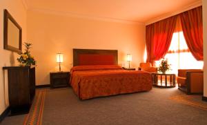 Postel nebo postele na pokoji v ubytování Hôtel Le Semiramis Marrakech by Bravia Hotels
