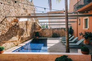 Het zwembad bij of vlak bij Gran Claustre Boutique Hotel