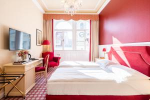 Postel nebo postele na pokoji v ubytování Aviano Boutique Hotel