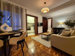 a living room with a couch and a table at R2R - El Rincon del Riego - 655A in Oviedo