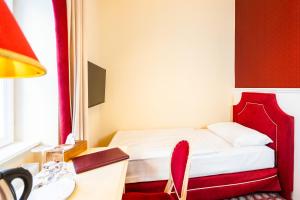 Postel nebo postele na pokoji v ubytování Aviano Boutique Hotel