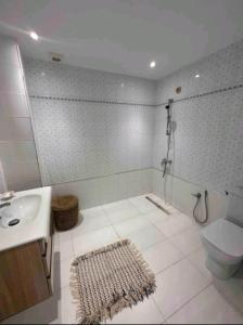 a bathroom with a shower and a toilet and a sink at Sidibou Said Vibes in Sidi Bou Saïd