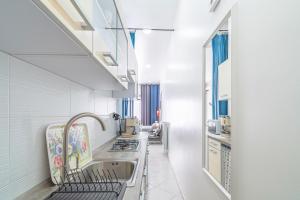 Η κουζίνα ή μικρή κουζίνα στο Casa Vacanze Blu Cobalto