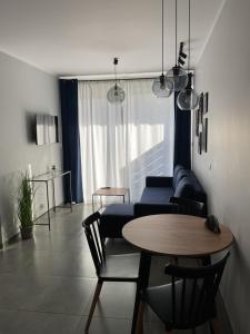 Posezení v ubytování Z Widokiem Apartamenty - apartamenty z widokiem na góry i zewnętrzną balią