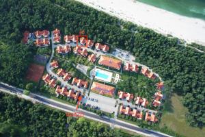 an aerial view of a group of houses next to the ocean at Sea You Beach House in Rogowo