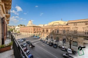 a view of a city street with cars and buildings at HOTIDAY Palermo Palco Noir in Palermo